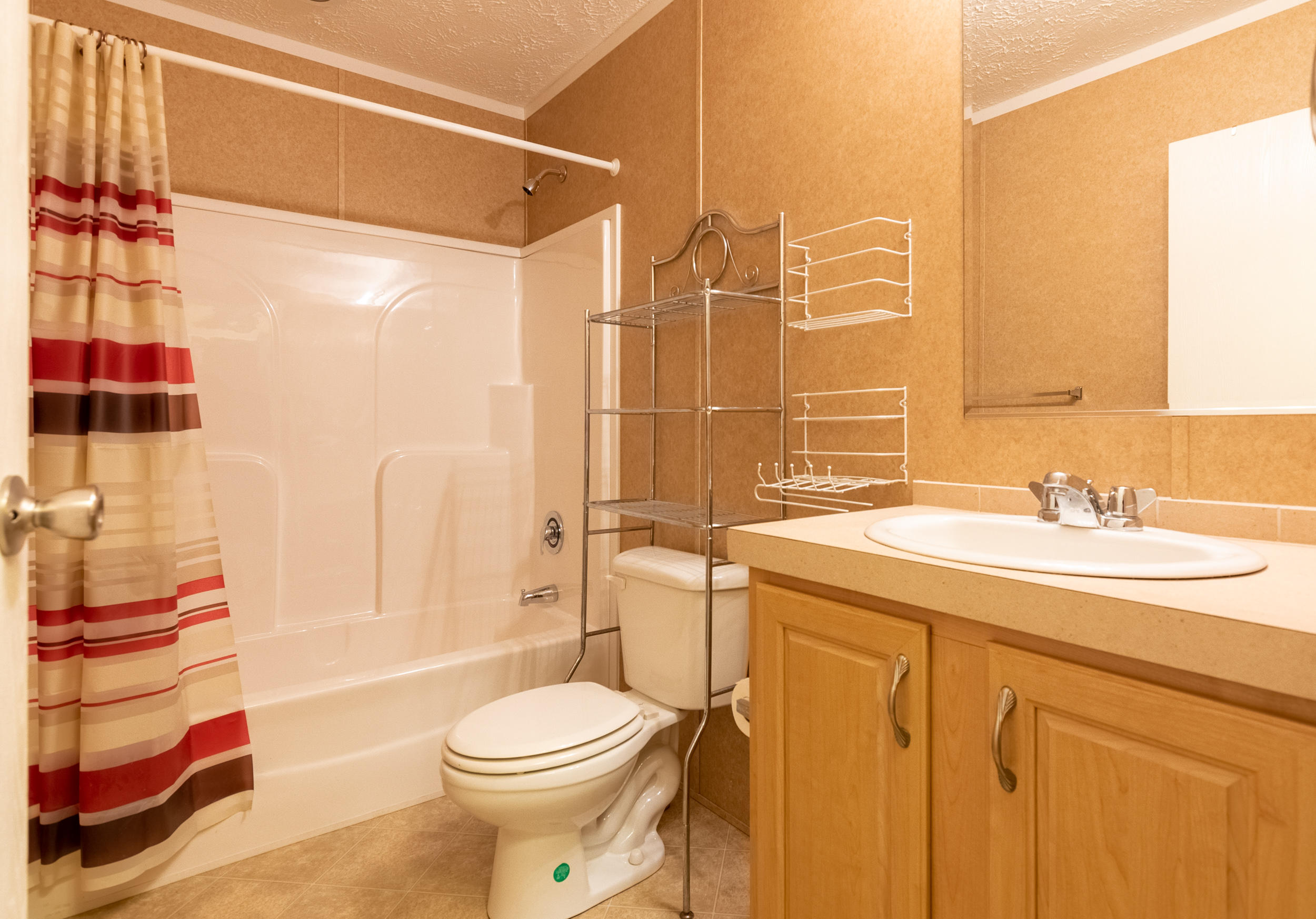 127 Millimeter Road Southwest Floyd, VA 24091 - Photo 17 of 31 a bathroom with a sink toilet and shower