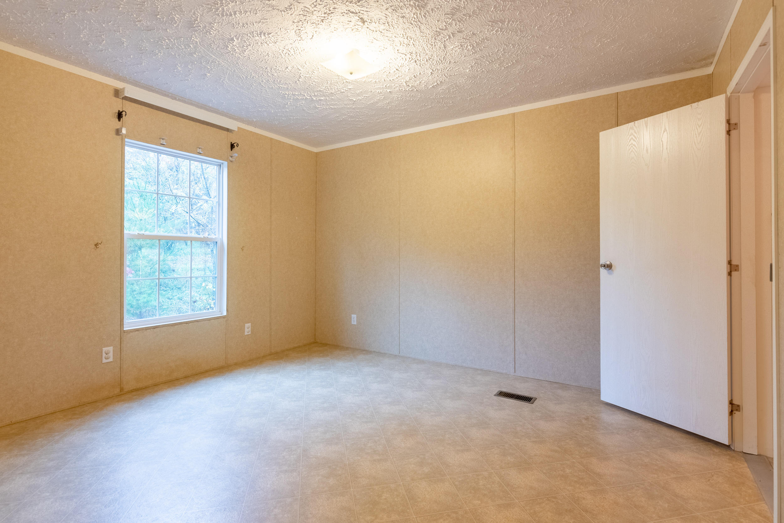 127 Millimeter Road Southwest Floyd, VA 24091 - Photo 20 of 31 a view of an empty room with a window