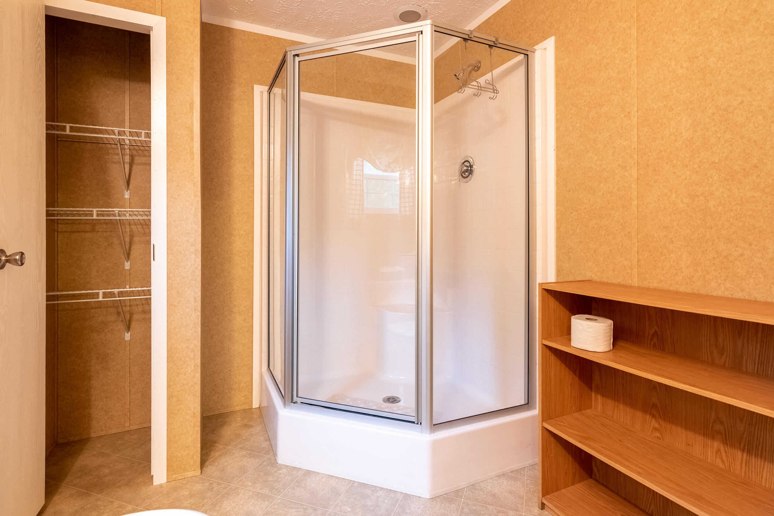 127 Millimeter Road Southwest Floyd, VA 24091 - Photo 25 of 31 a bathroom with a glass shower door