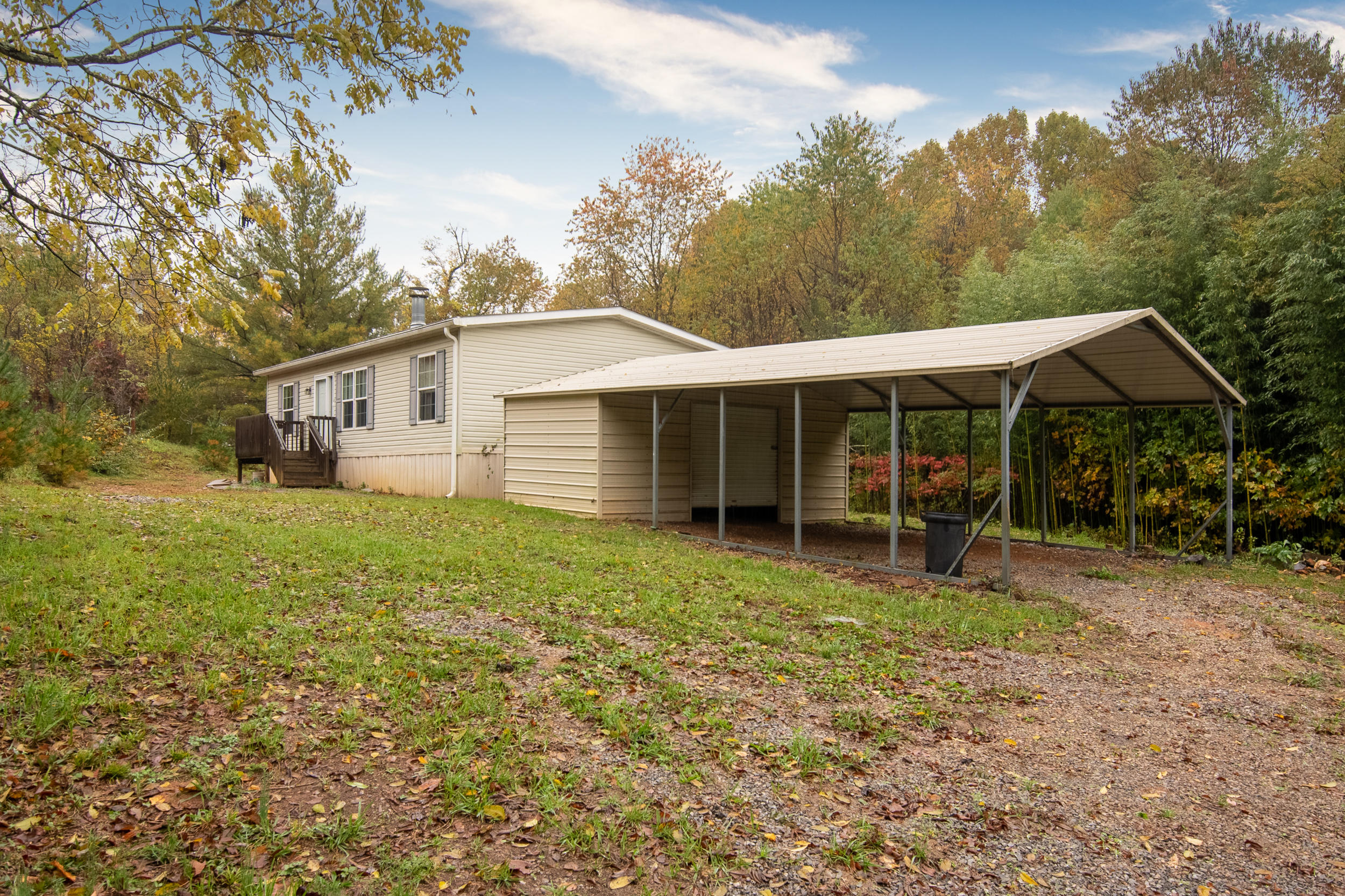 127 Millimeter Road Southwest Floyd, VA 24091 - Photo 28 of 31 a view of a house with a yard and sitting area