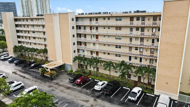 an aerial view of houses with yard