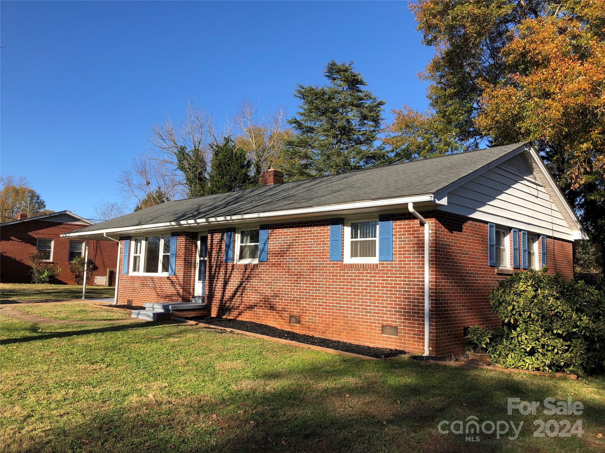 158 Crestview Street Rutherfordton, NC 28139 - Photo 1 of 34 a front view of a house with a yard