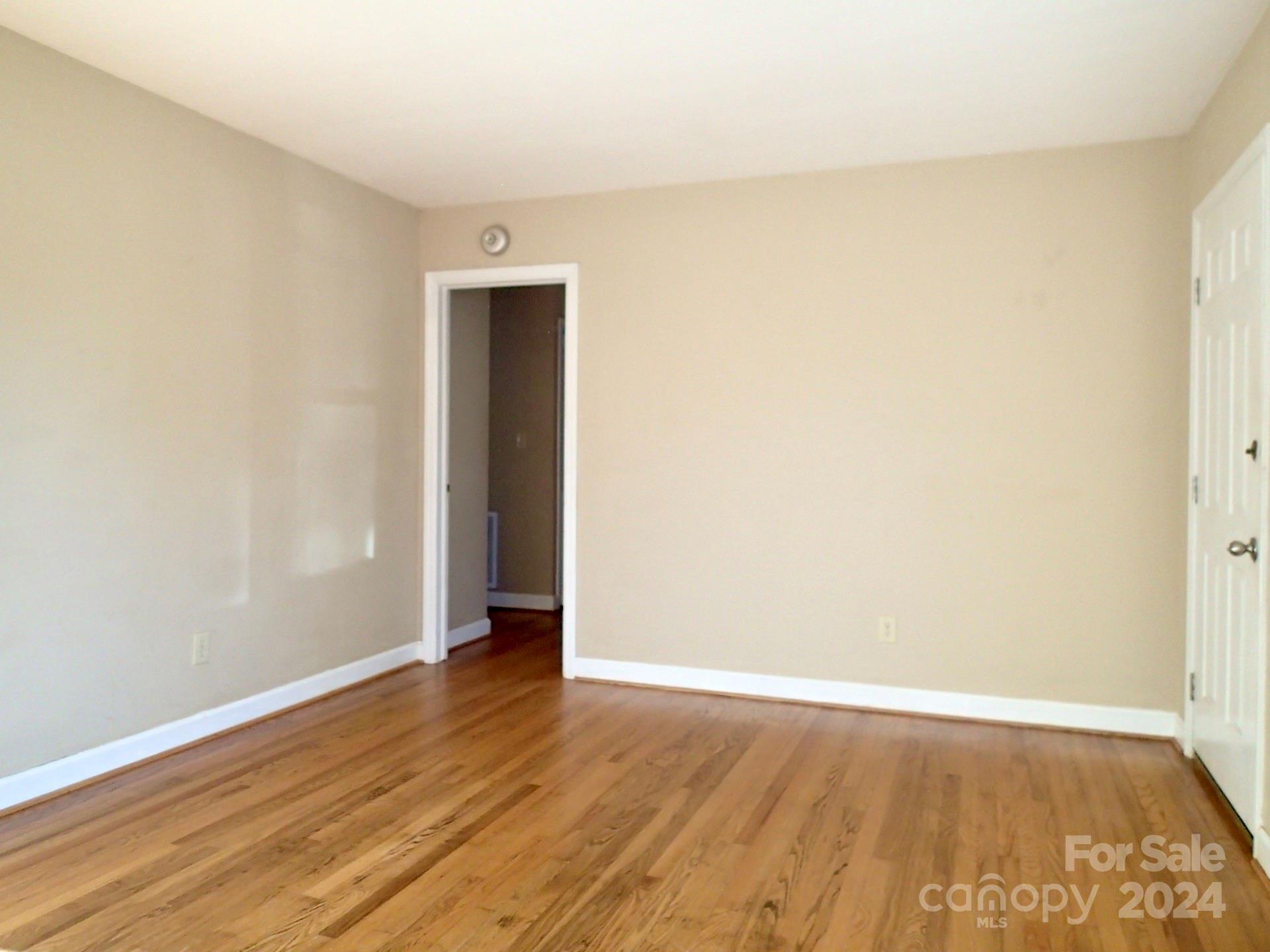 158 Crestview Street Rutherfordton, NC 28139 - Photo 12 of 34 a view of an empty room with wooden floor