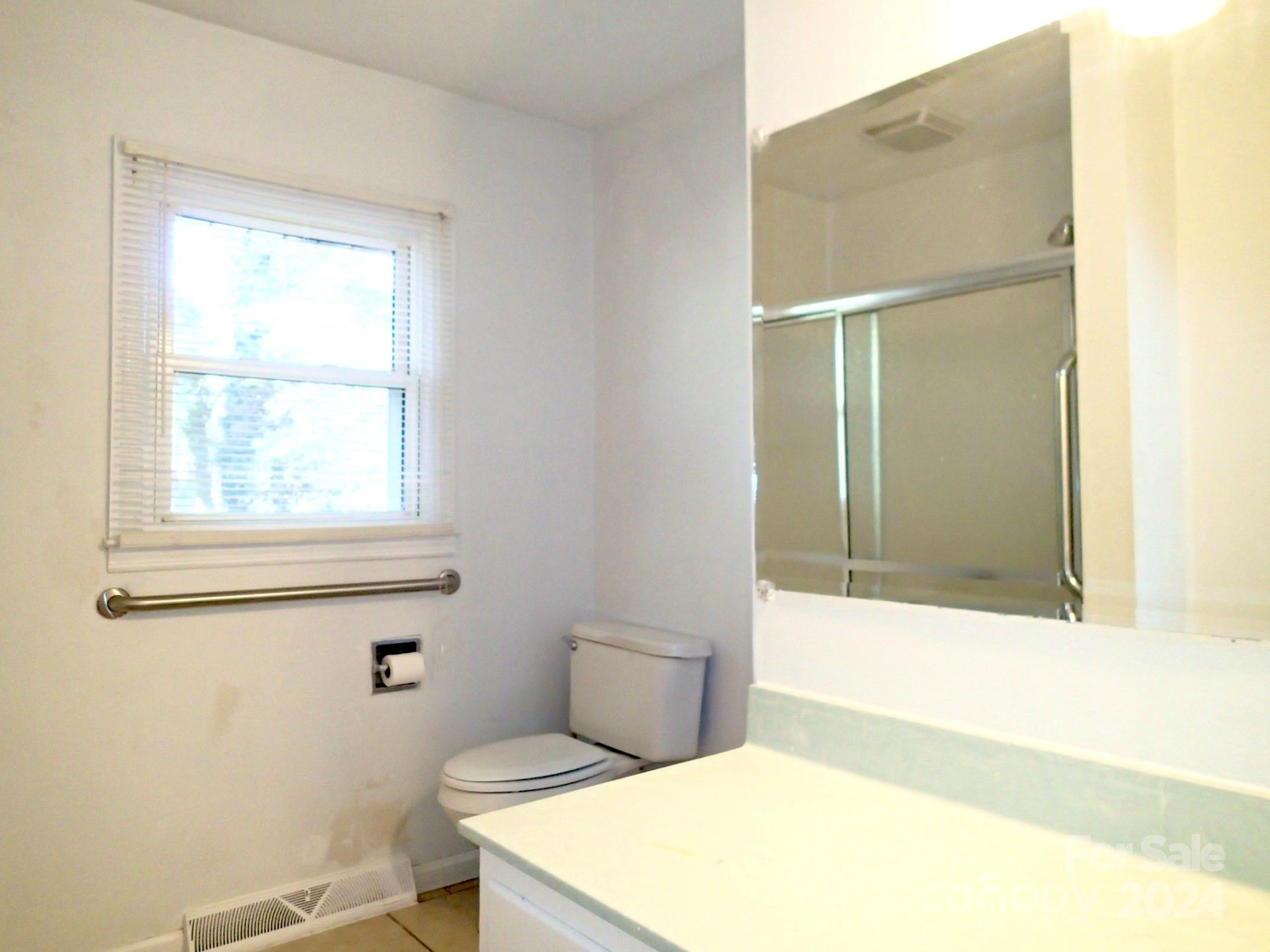 158 Crestview Street Rutherfordton, NC 28139 - Photo 13 of 34 a bathroom with a toilet and a shower