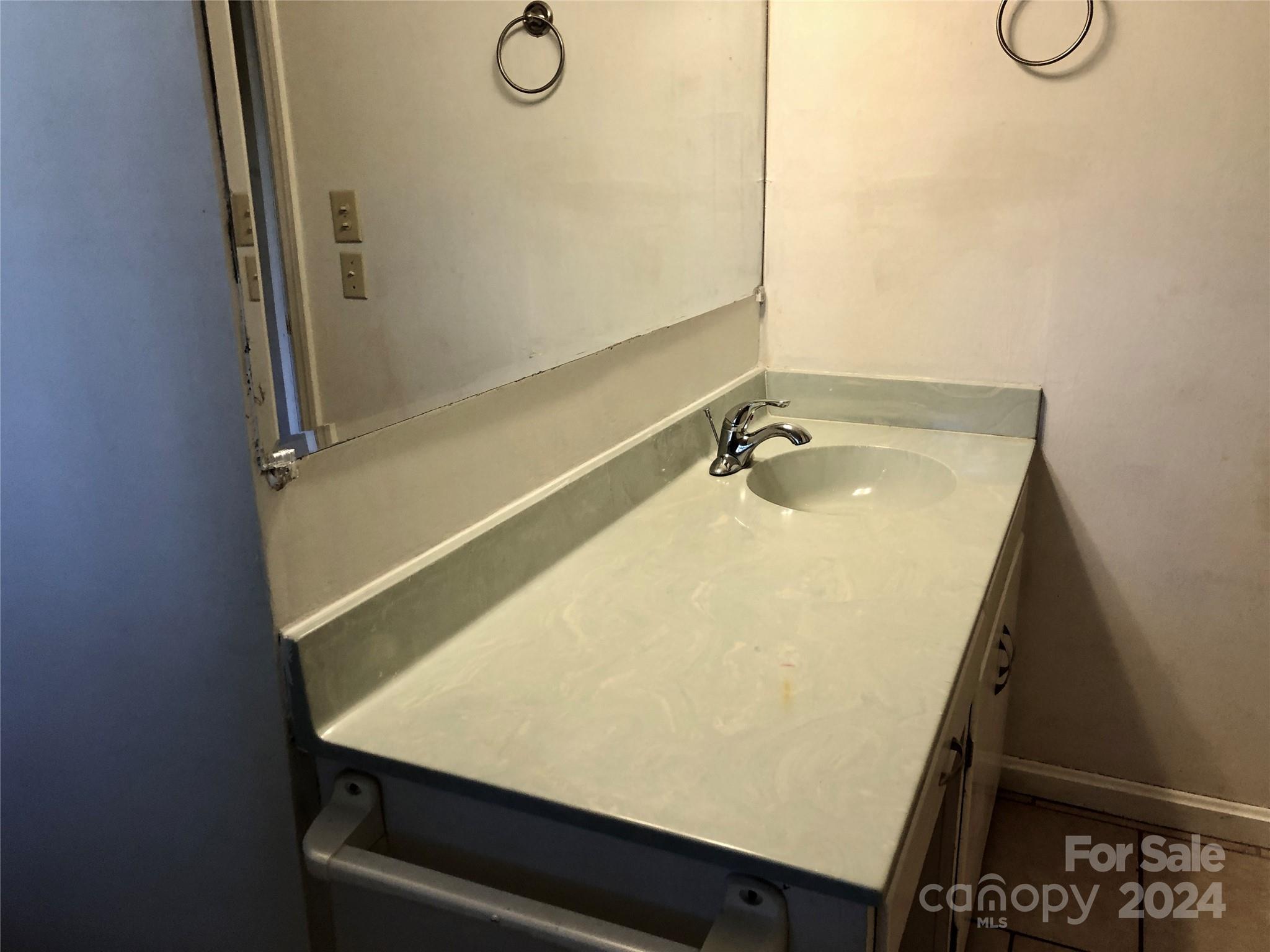 158 Crestview Street Rutherfordton, NC 28139 - Photo 15 of 34 a bathroom with a sink and a mirror