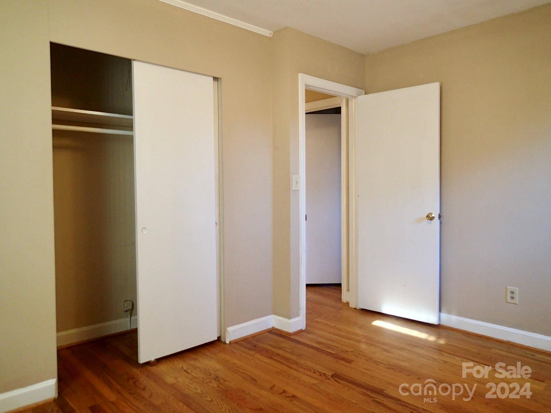 158 Crestview Street Rutherfordton, NC 28139 - Photo 17 of 34 a view of an empty room with wooden floor and closet