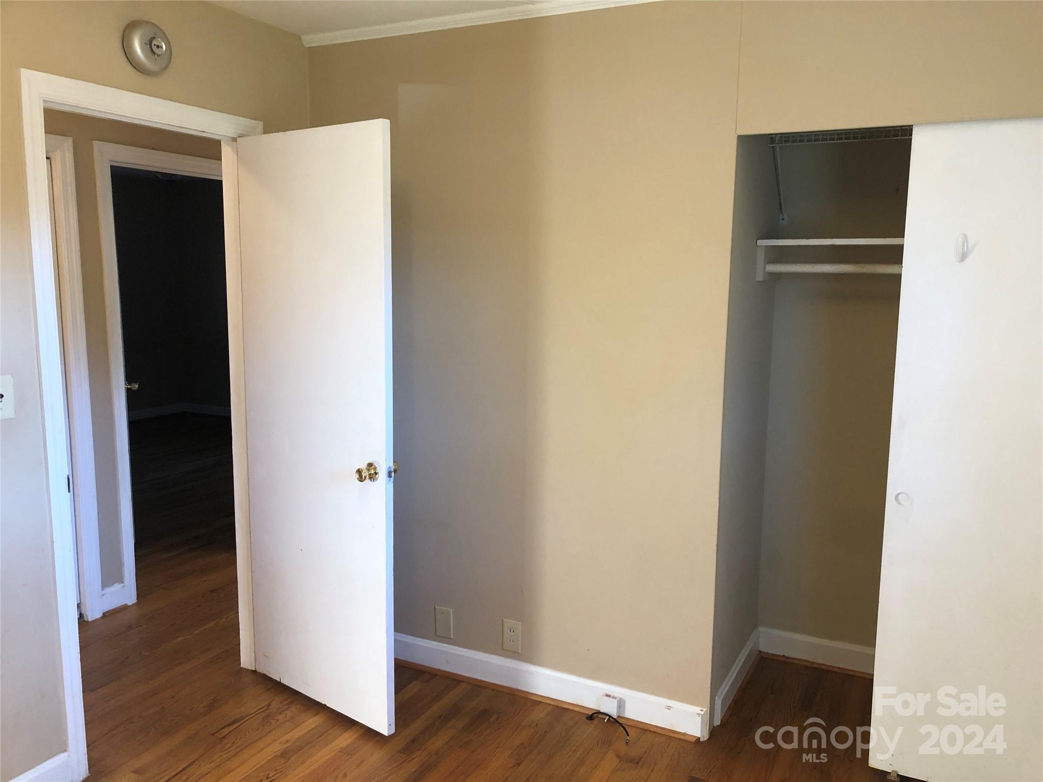 158 Crestview Street Rutherfordton, NC 28139 - Photo 18 of 34 a view of walk in closet with wooden floor