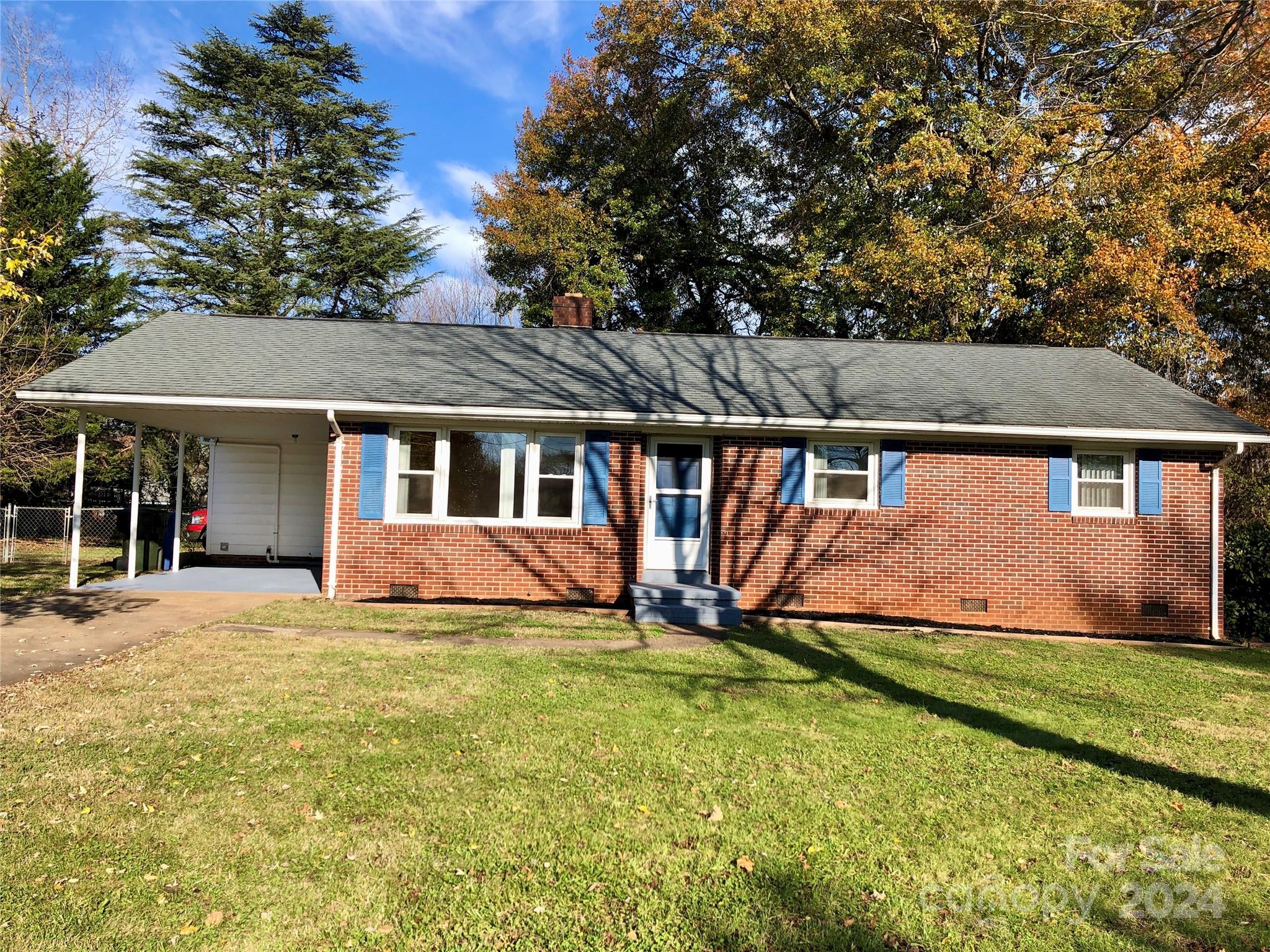 158 Crestview Street Rutherfordton, NC 28139 - Photo 2 of 34 a view of a house with a yard and sitting area