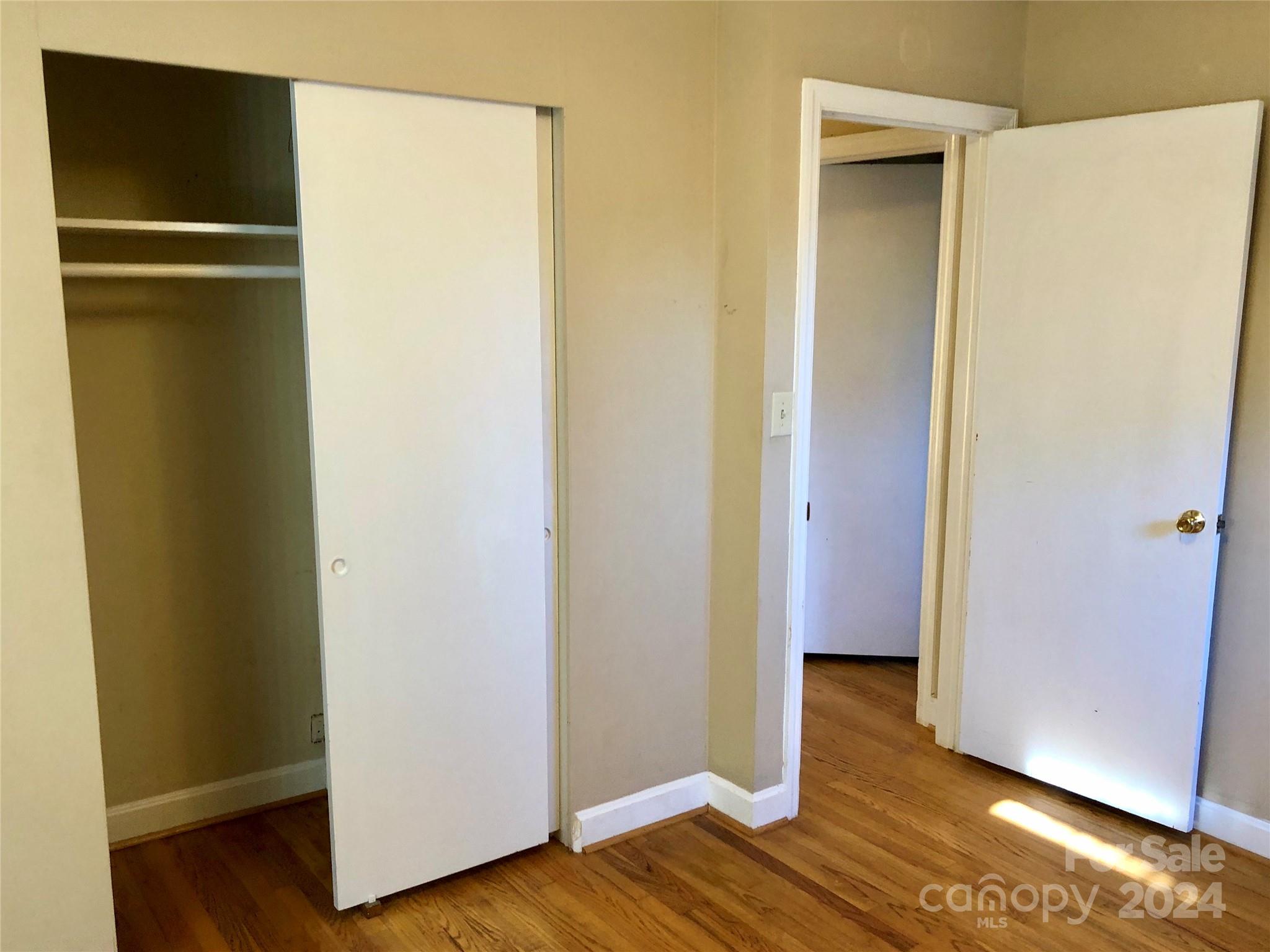 158 Crestview Street Rutherfordton, NC 28139 - Photo 22 of 34 a view of walk in closet with wooden floor