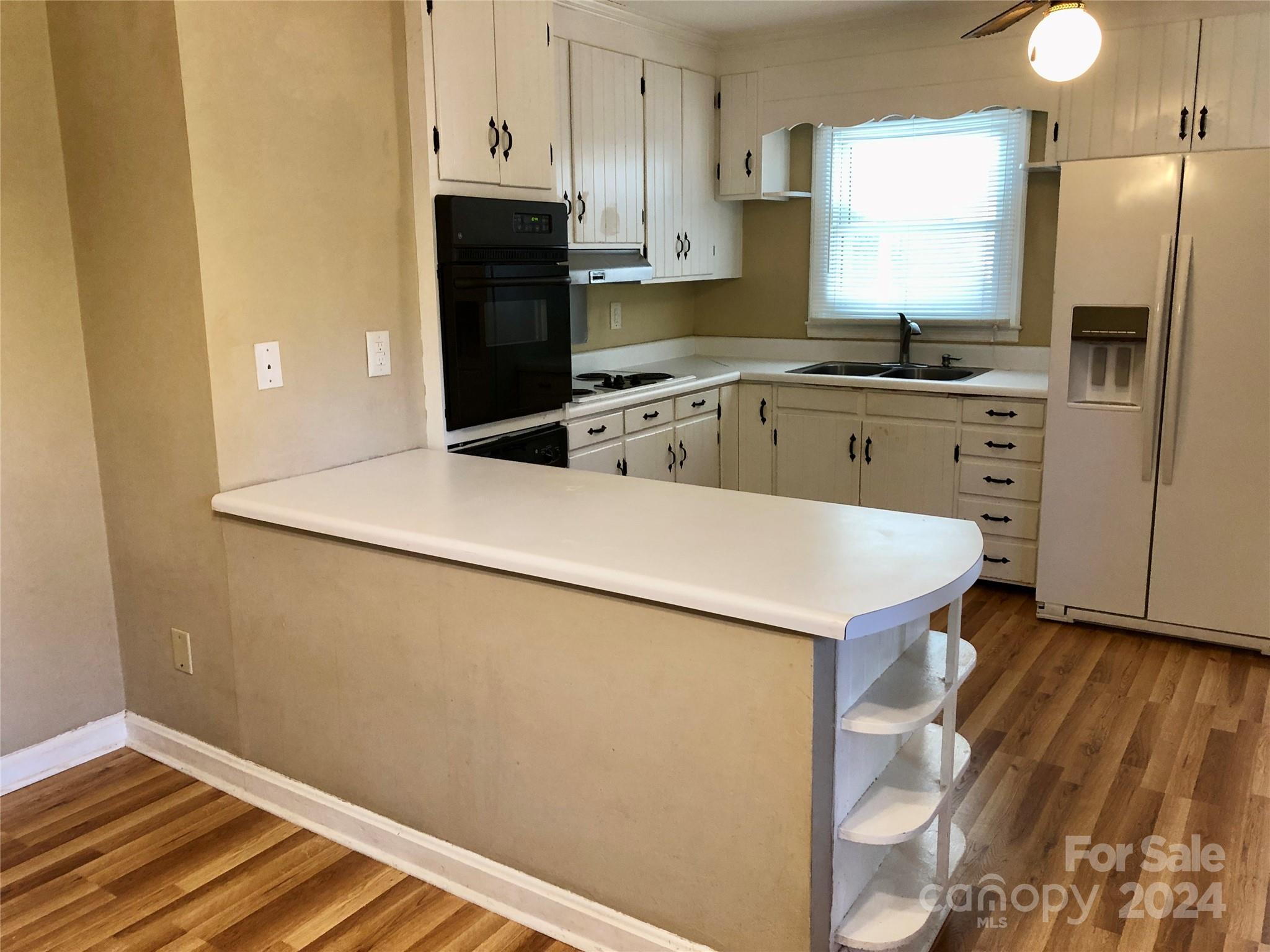 158 Crestview Street Rutherfordton, NC 28139 - Photo 7 of 34 a kitchen with stainless steel appliances a refrigerator sink and stove