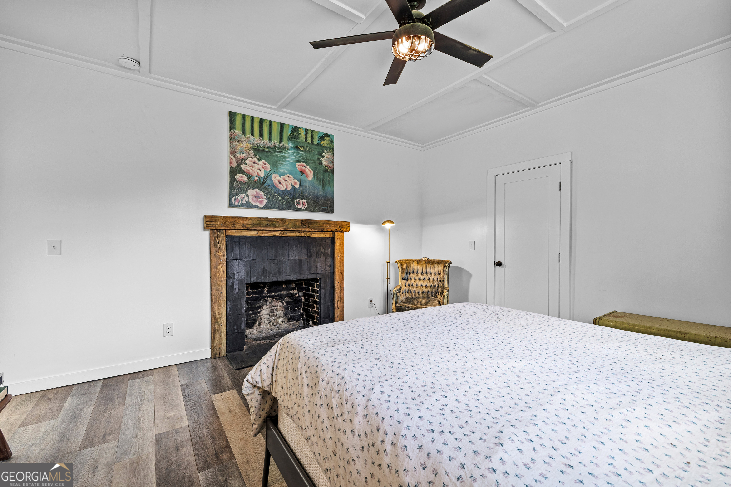 1329 Standing Rock Road Senoia, GA 30276 - Photo 43 of 77 a bedroom with a bed and a fireplace