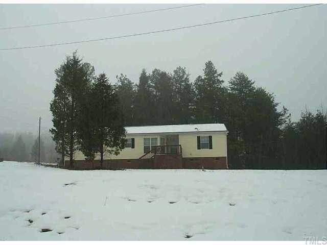 7912 McKee Road Rougemont, NC 27572 - Photo 1 of 1 a front view of a house with a yard