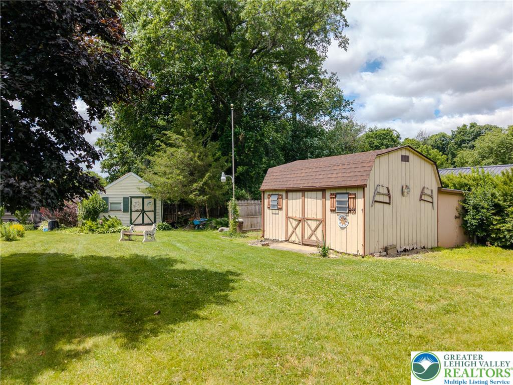 40 Locke Heights Road Bangor, PA 18013 - Photo 5 of 28 A verdant yard offers ample space with two charming utility sheds.