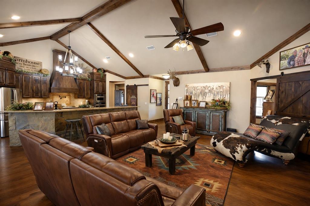 1011 Red Road Howe, TX 75459 - Photo 7 of 39 a living room with furniture gym equipment and a large window
