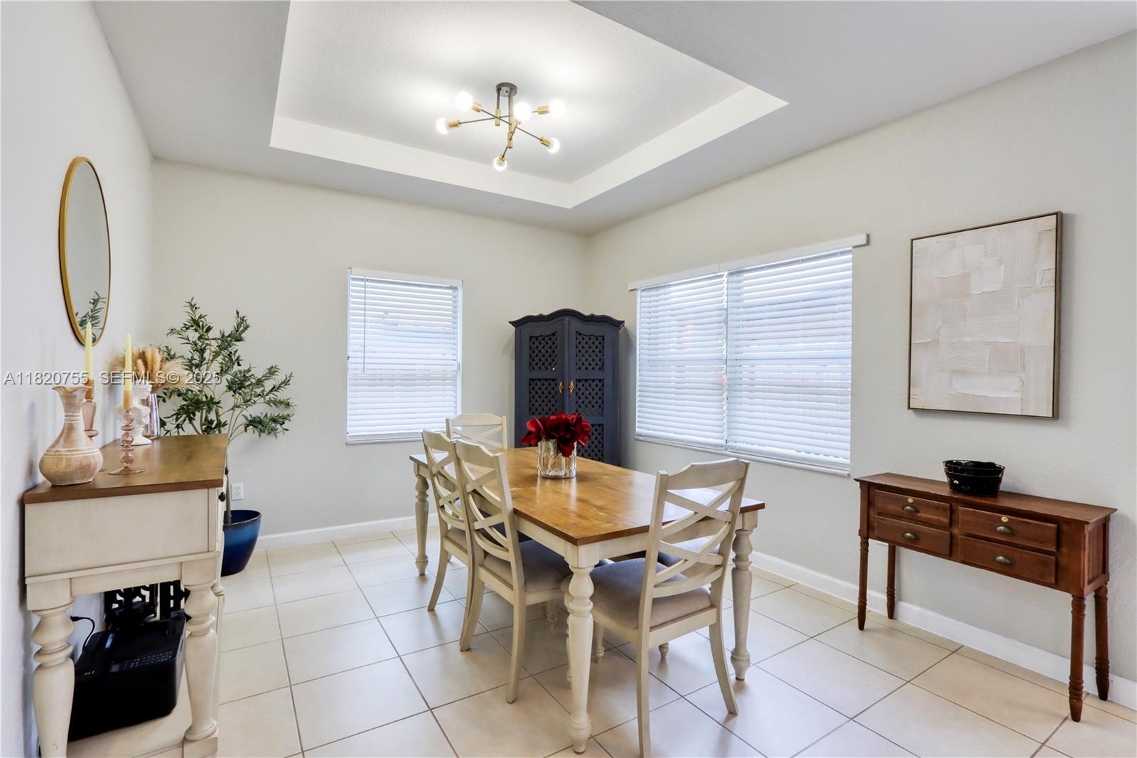 148 Northeast 36th Avenue Road Homestead, FL 33033 - Photo 14 of 53 a view of a dining room with furniture and chandelier