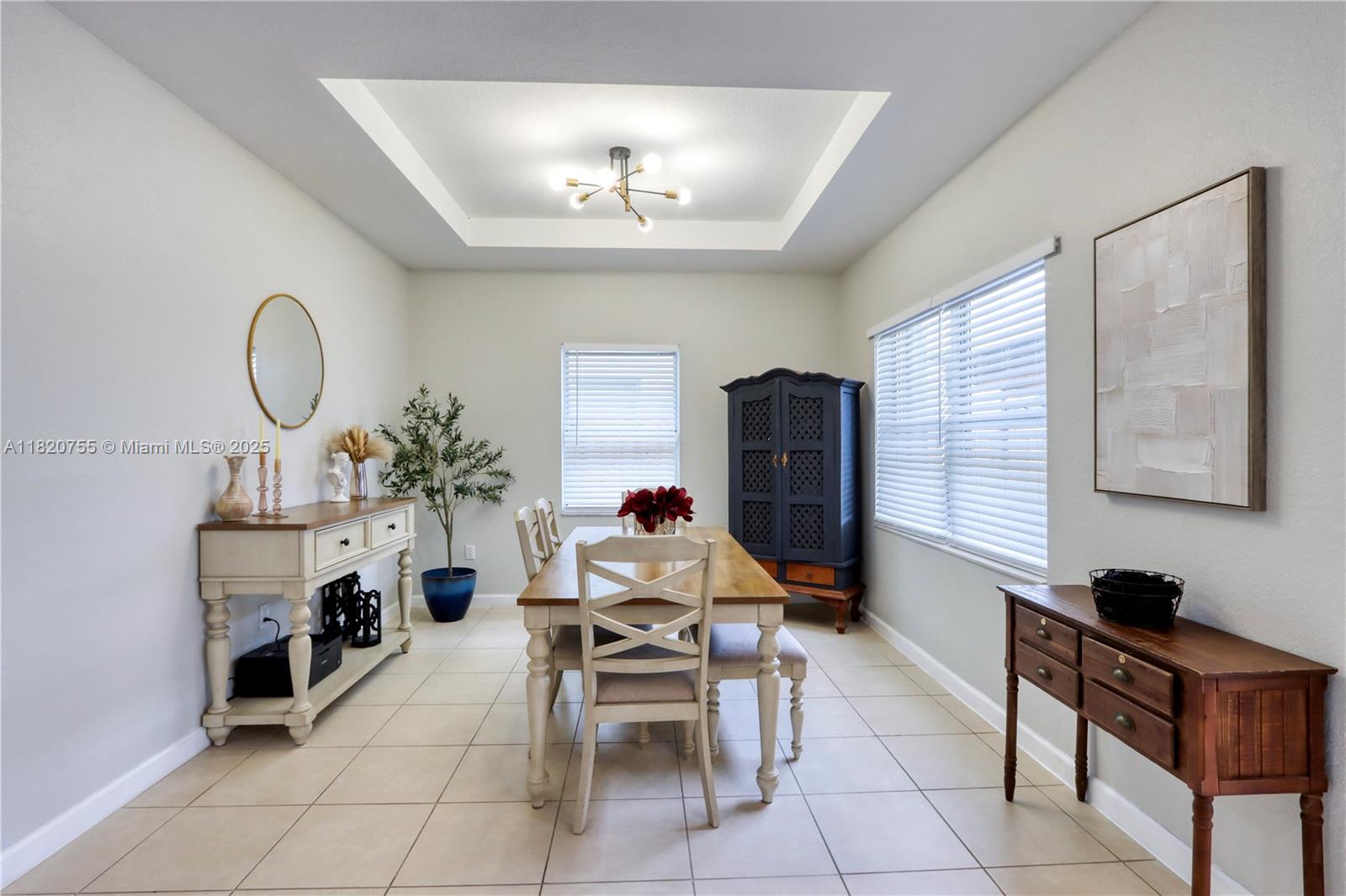148 Northeast 36th Avenue Road Homestead, FL 33033 - Photo 15 of 53 a living room with furniture a dining table and a fireplace