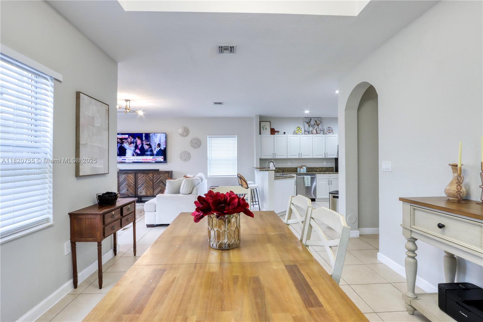 148 Northeast 36th Avenue Road Homestead, FL 33033 - Photo 16 of 53 a living room with furniture and a chandelier