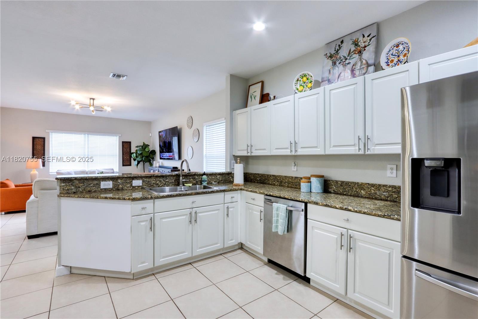 148 Northeast 36th Avenue Road Homestead, FL 33033 - Photo 21 of 53 a kitchen with granite countertop cabinets stainless steel appliances and a sink