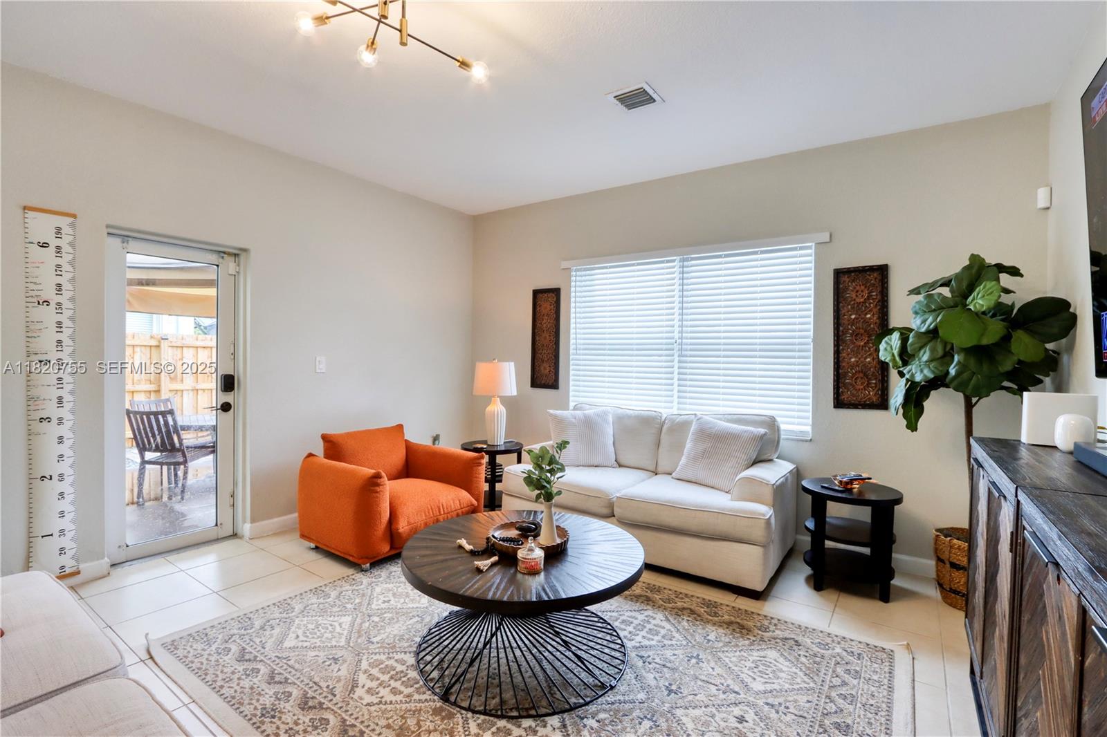 148 Northeast 36th Avenue Road Homestead, FL 33033 - Photo 24 of 53 a living room with furniture and a potted plant