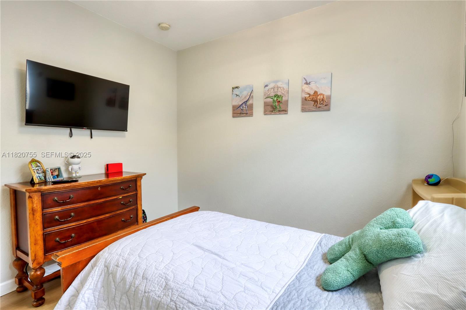 148 Northeast 36th Avenue Road Homestead, FL 33033 - Photo 40 of 53 a bedroom with a bed and a flat screen tv