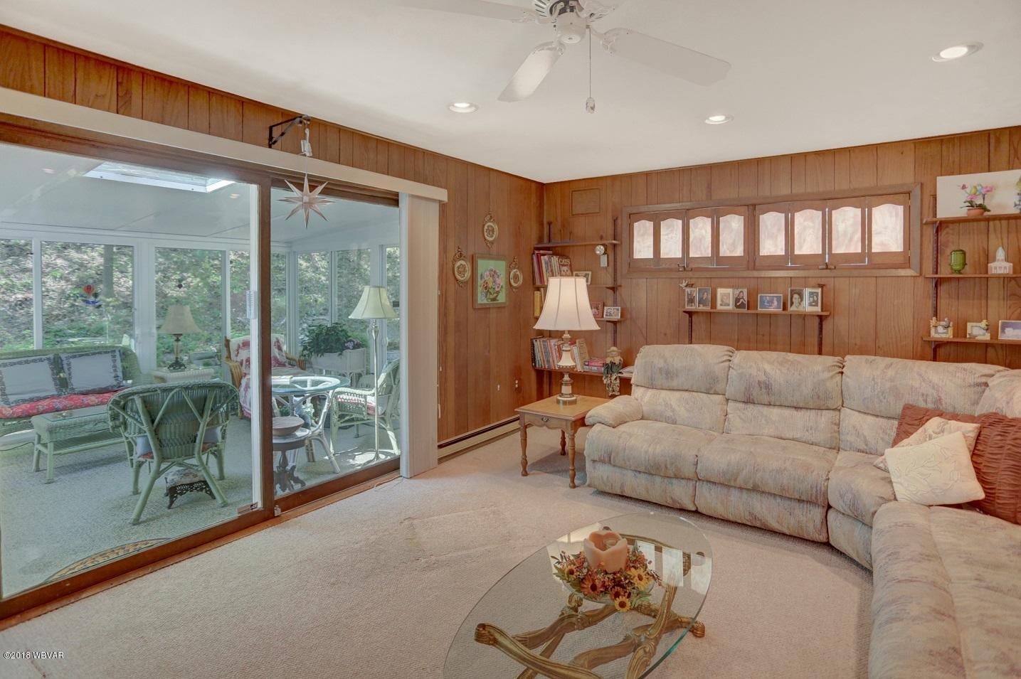 1801 Ravine Road Williamsport, PA 17701 - Photo 17 of 36 Family Room opens to Florida Room