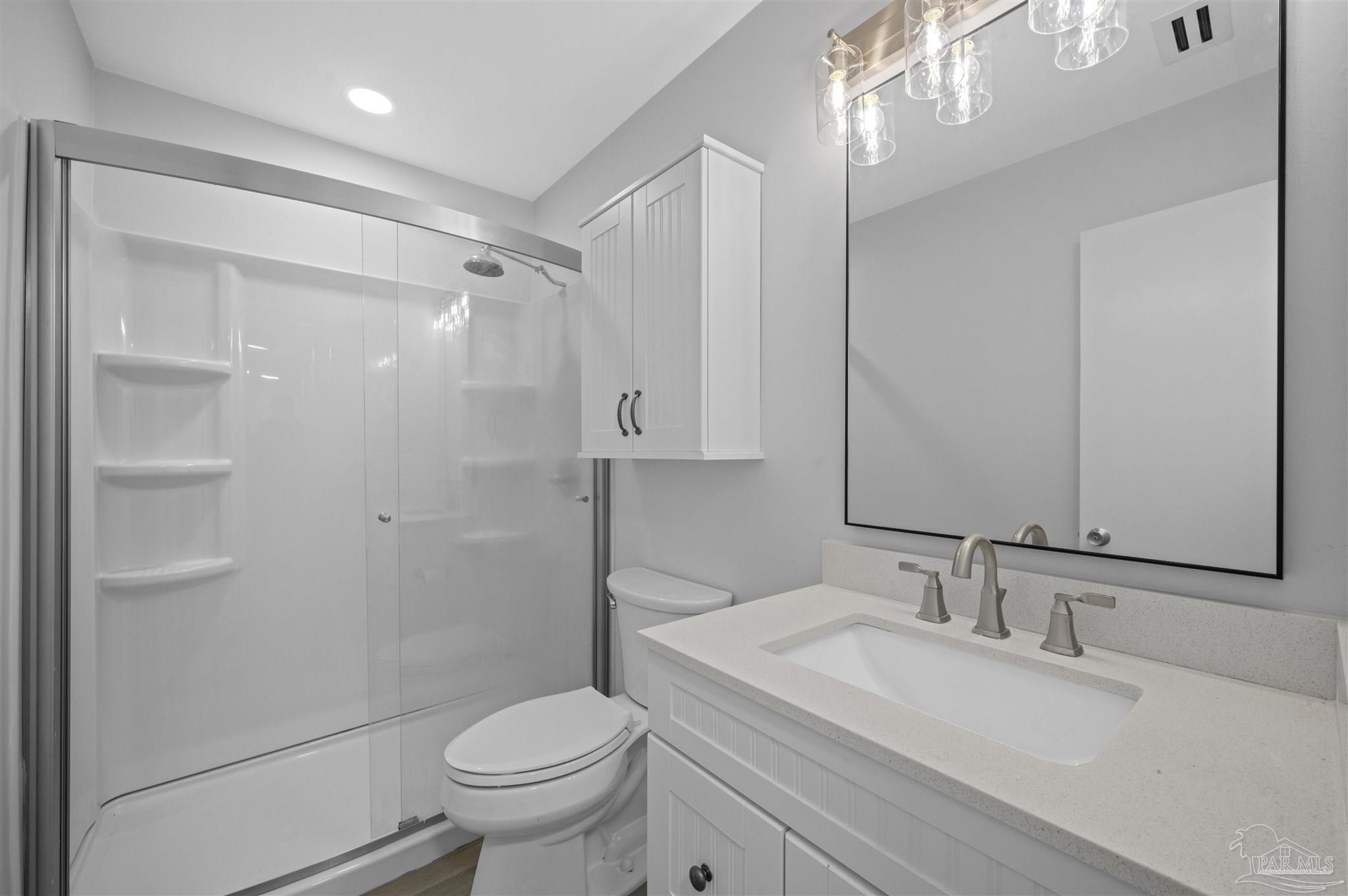 16470 Perdido Key Drive, Unit 33B Perdido Key, FL 32507 - Photo 16 of 32 a bathroom with a sink toilet double vanity and shower
