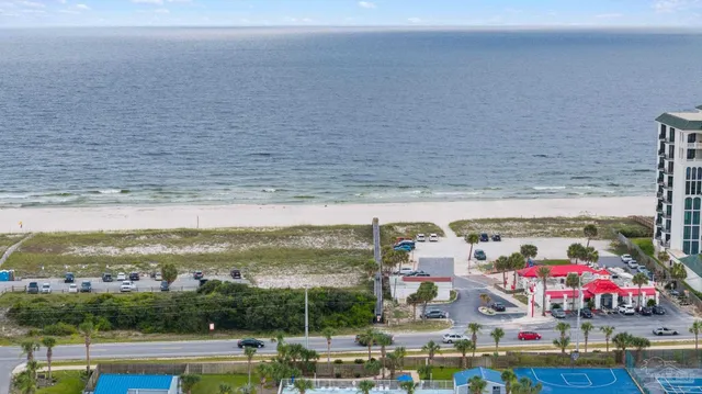 an aerial view of beach and ocean