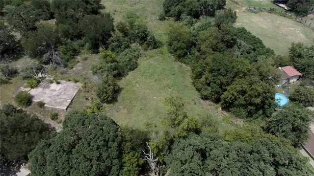an aerial view of residential house with outdoor space