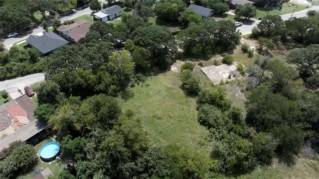 an aerial view of house with yard swimming pool and outdoor seating