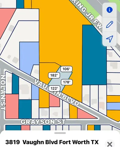 a view of a street with tall buildings