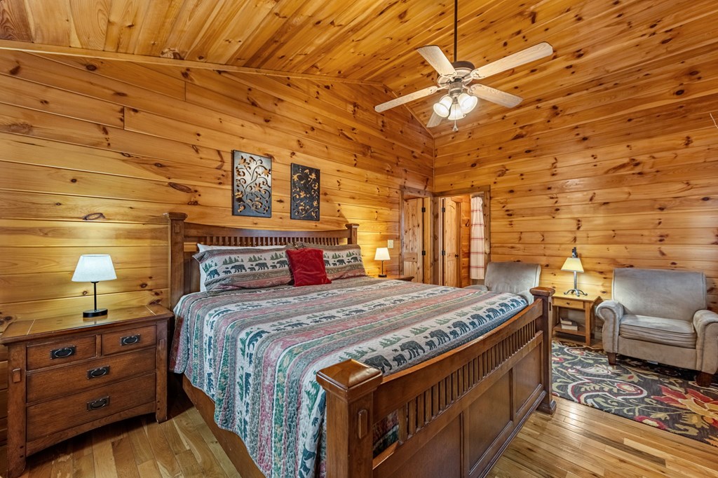 126 Sugar Mountain Road Blue Ridge, GA 30513 - Photo 17 of 78 a bedroom with a bed and a couch