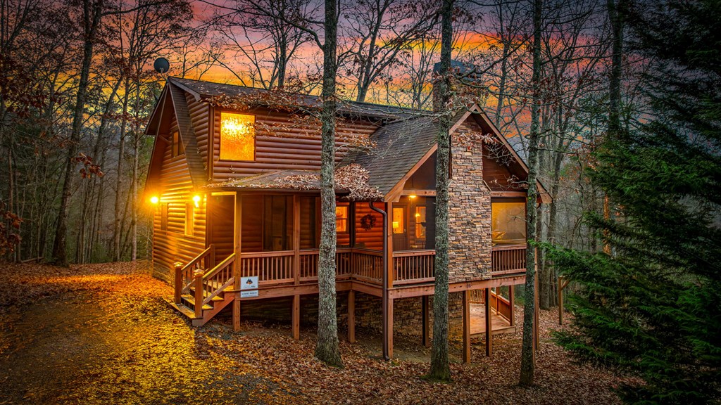 126 Sugar Mountain Road Blue Ridge, GA 30513 - Photo 23 of 78 a view of a chairs and table in the backyard