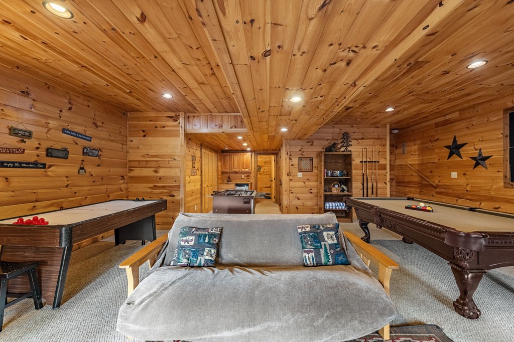 126 Sugar Mountain Road Blue Ridge, GA 30513 - Photo 30 of 78 a living room with furniture and a fireplace