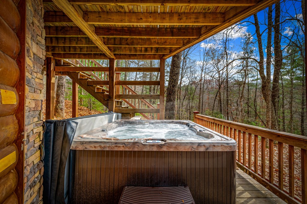 126 Sugar Mountain Road Blue Ridge, GA 30513 - Photo 32 of 78 a roof deck with a table and chairs