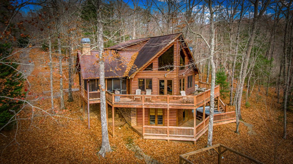 126 Sugar Mountain Road Blue Ridge, GA 30513 - Photo 36 of 78 an aerial view of a house with a yard