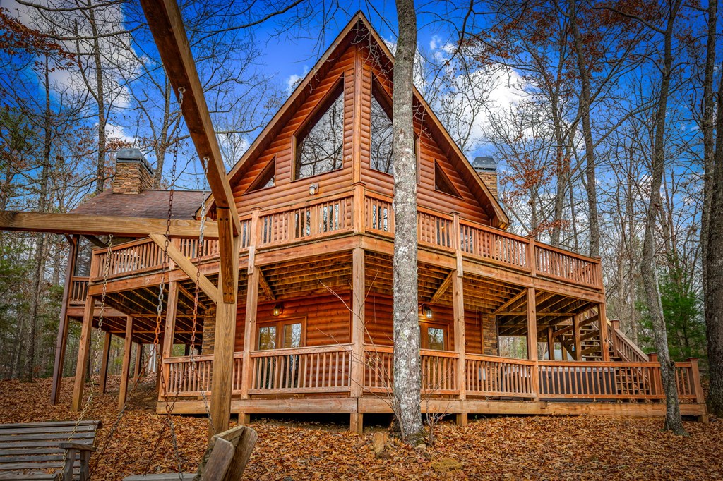 126 Sugar Mountain Road Blue Ridge, GA 30513 - Photo 47 of 78 front view of a house with a small yard