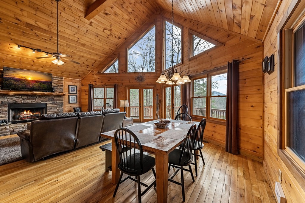 126 Sugar Mountain Road Blue Ridge, GA 30513 - Photo 5 of 78 a view of a dining room with furniture window and wooden floor