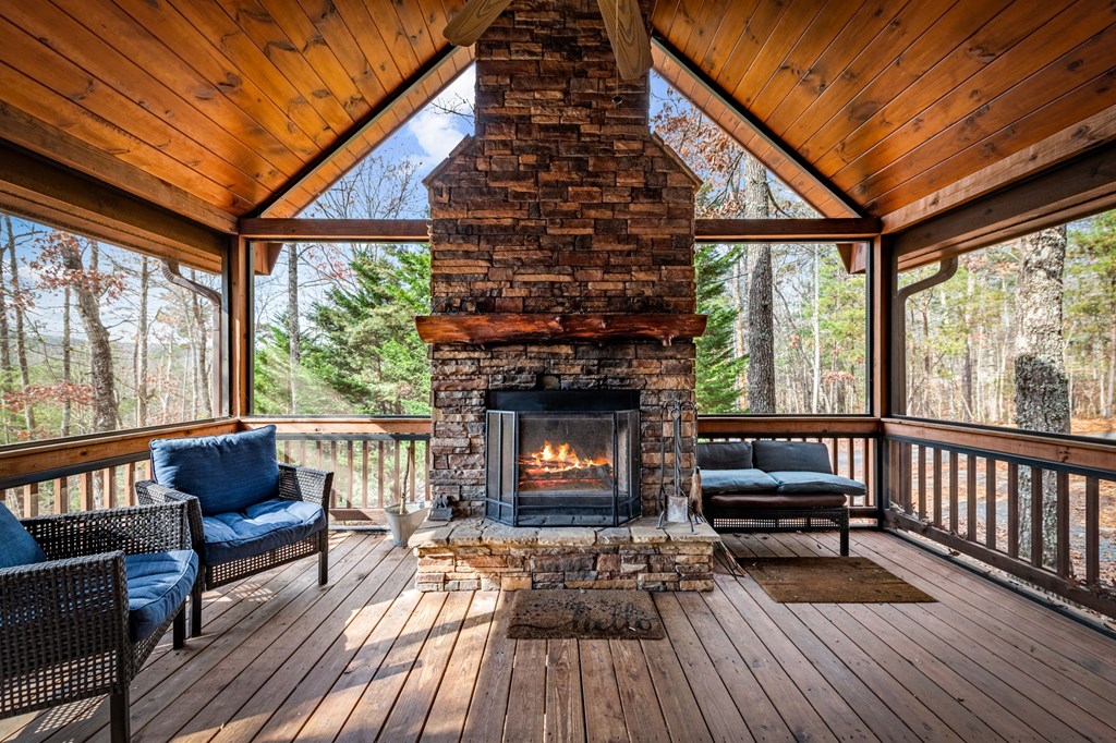 126 Sugar Mountain Road Blue Ridge, GA 30513 - Photo 53 of 78 a living room with furniture and a fireplace