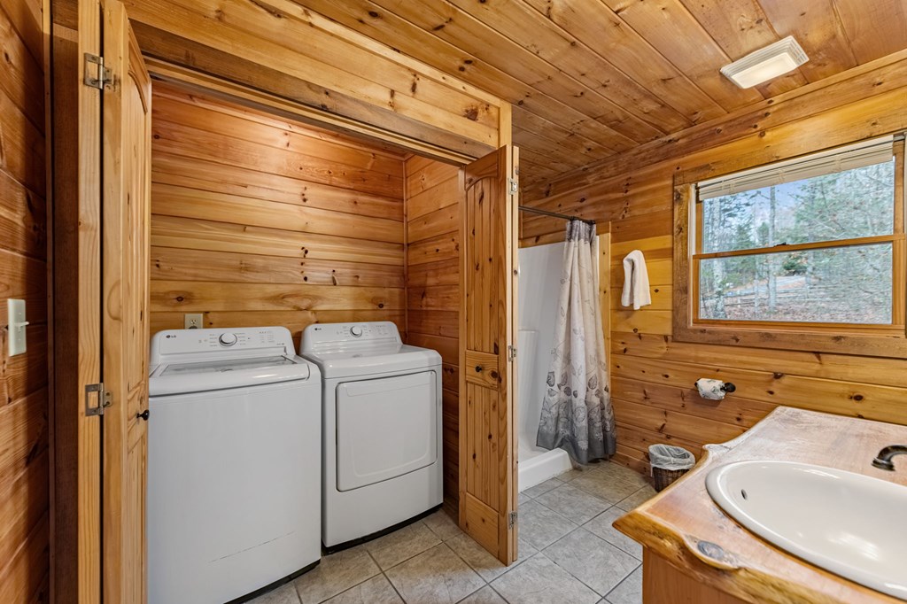 126 Sugar Mountain Road Blue Ridge, GA 30513 - Photo 59 of 78 a bathroom with a sink and mirror