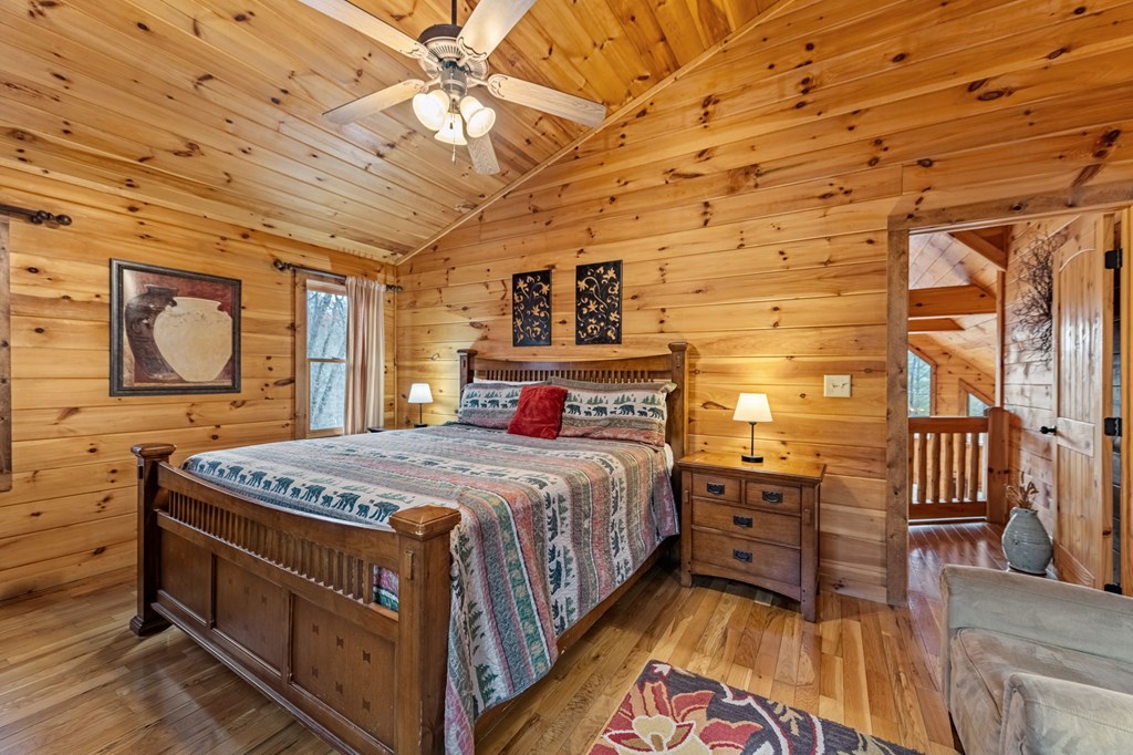 126 Sugar Mountain Road Blue Ridge, GA 30513 - Photo 60 of 78 a bedroom with a bed dresser and a window