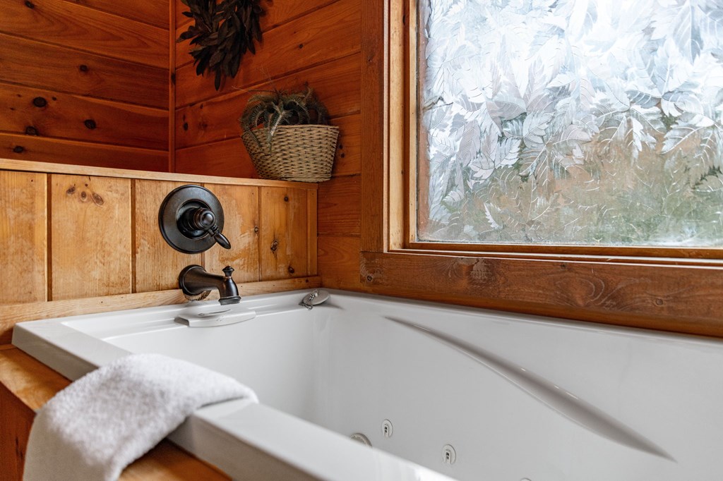126 Sugar Mountain Road Blue Ridge, GA 30513 - Photo 66 of 78 a bathroom with a sink and a mirror