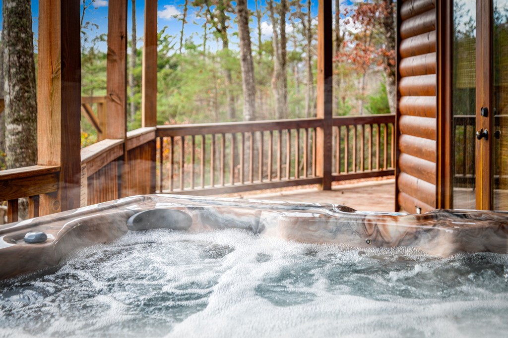 126 Sugar Mountain Road Blue Ridge, GA 30513 - Photo 71 of 78 a view of a porch with a floor to ceiling window