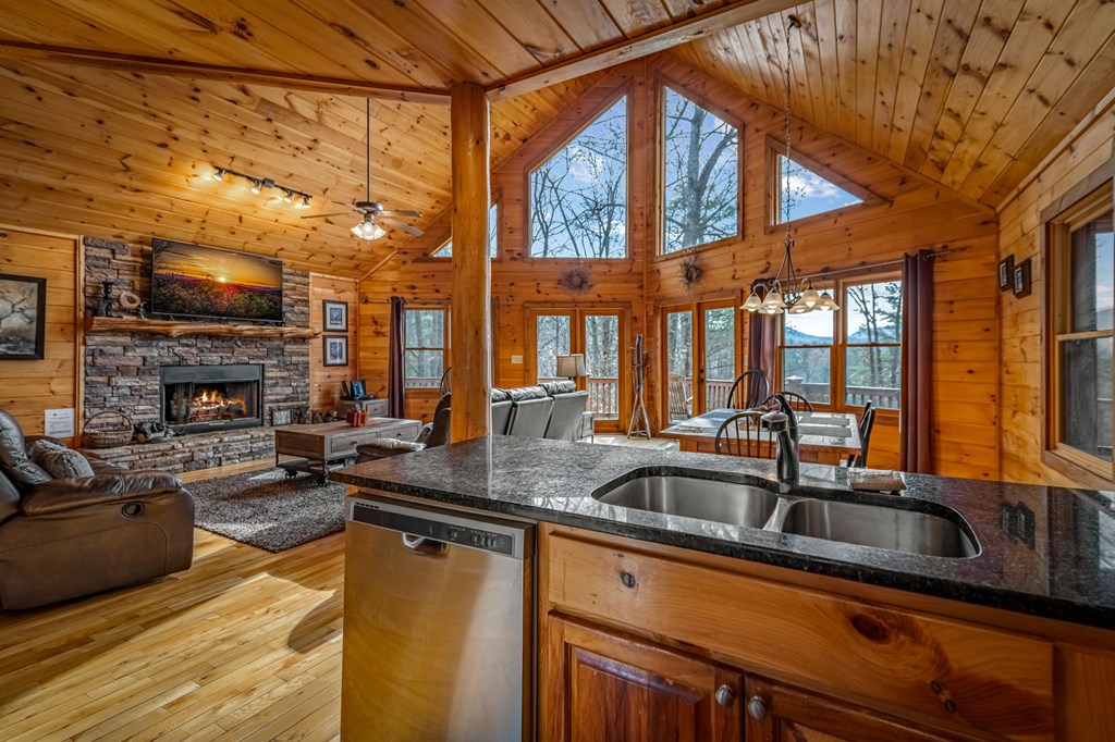 126 Sugar Mountain Road Blue Ridge, GA 30513 - Photo 8 of 78 a kitchen with a sink a counter top space and stainless steel appliances