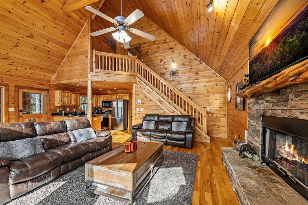 126 Sugar Mountain Road Blue Ridge, GA 30513 - Photo 10 of 78 a outdoor space with patio lots of furniture and wooden floor
