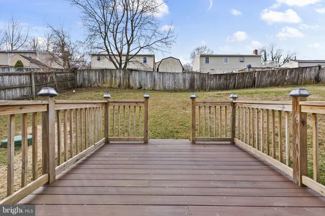 a view of a house with wooden deck