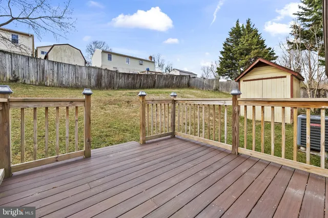 a view of wooden deck and a lake view