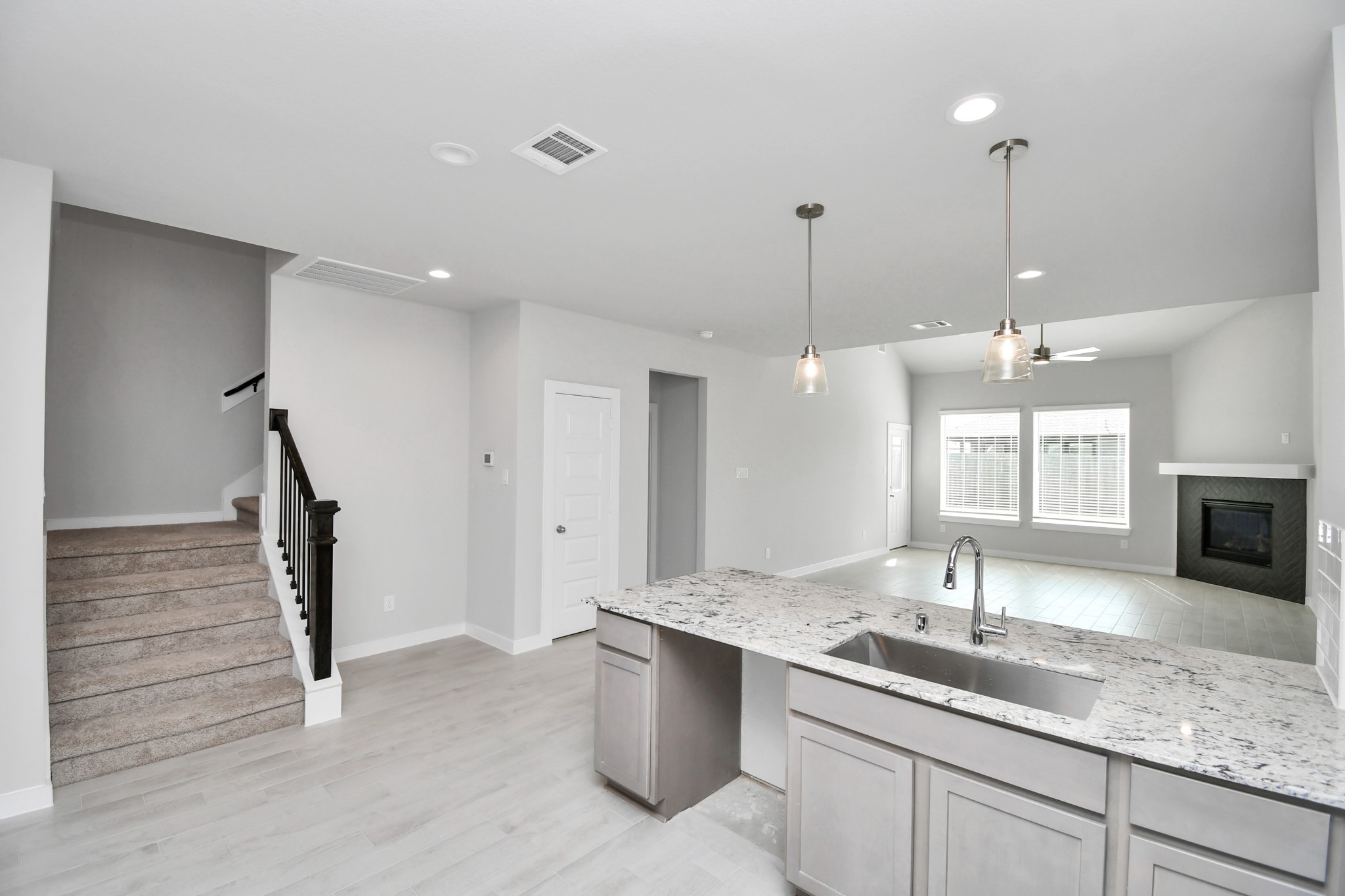 14606 Surfbird Lane Houston, TX 77049 - Photo 13 of 45 The open concept effortlessly connects the kitchen to the expansive family room, forming a perfect hub for gatherings. This seamless flow creates an inviting space where cooking and socializing come together harmoniously.