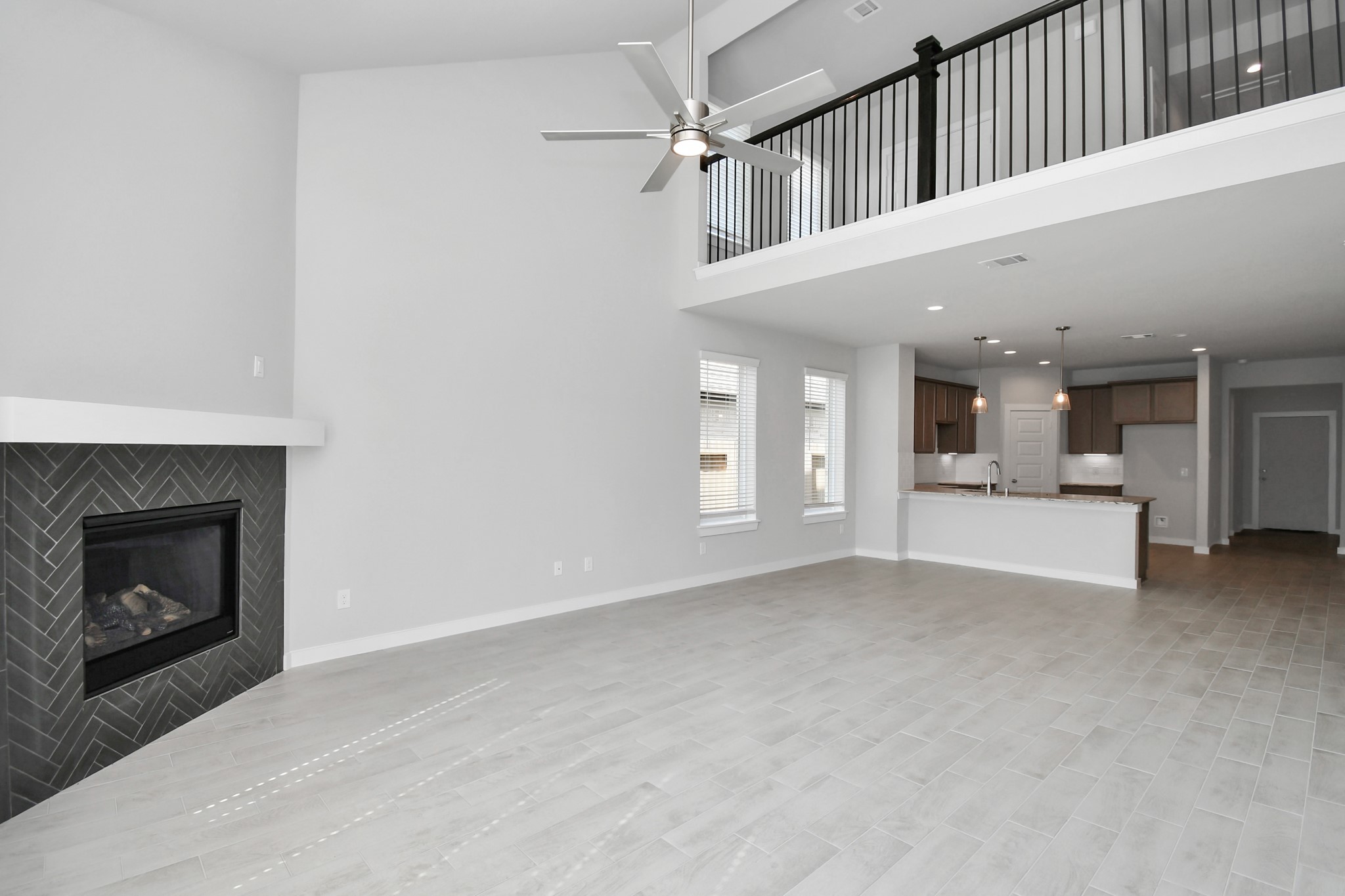 14606 Surfbird Lane Houston, TX 77049 - Photo 19 of 45 Take another glimpse into the heart of the home with this additional view of the family room—a sprawling space ready to accommodate all your gatherings.