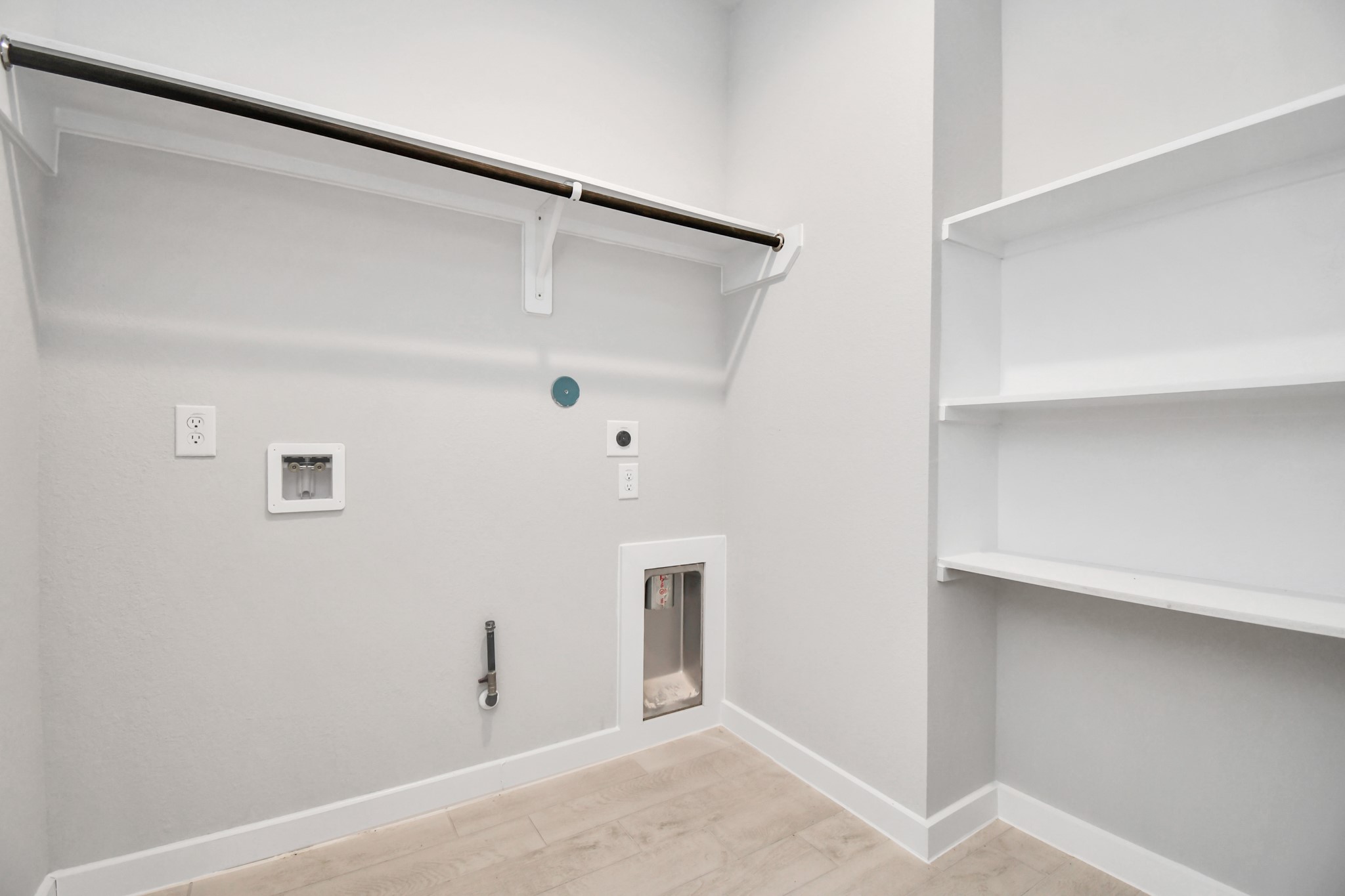 14606 Surfbird Lane Houston, TX 77049 - Photo 37 of 45 A perfect blend of functionality and comfort. Capture the essence of easy living with a first-floor laundry room, thoughtfully equipped with shelving for effortless organization. Both electric and gas connections available.