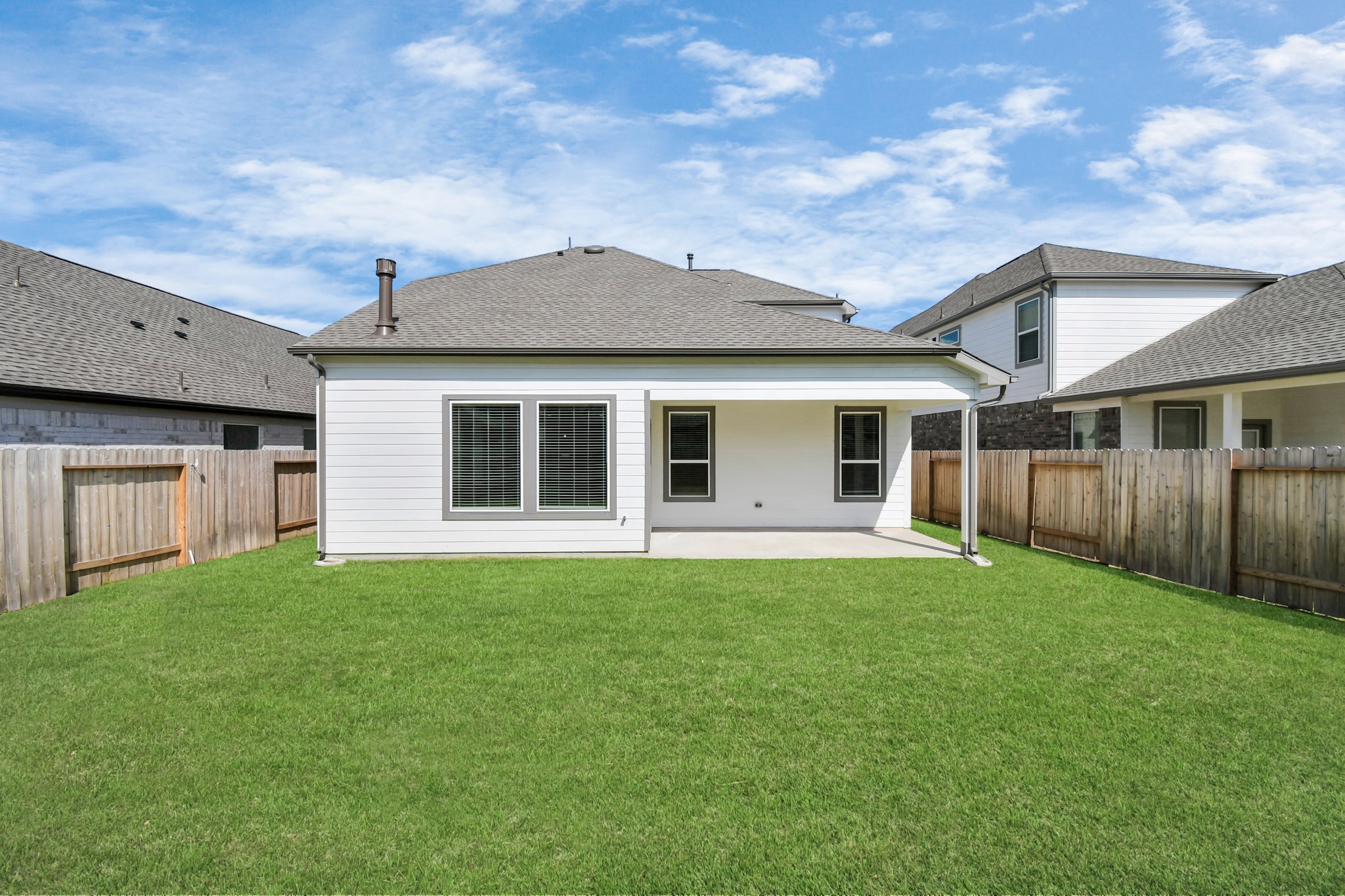 14606 Surfbird Lane Houston, TX 77049 - Photo 40 of 45 Backyard retreat, offering an abundance of space for kids to play and explore. The possibilities are endless in this outdoor haven, where the joy of open-air activities and family gatherings awaits.